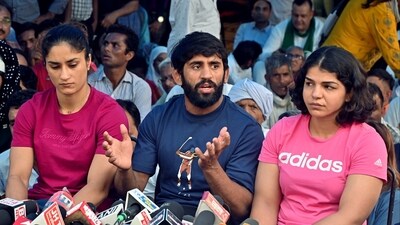 Wrestlers Bajrang Punia, Vinesh Phogat and Sakshi Mallik addresses the press conference in the ongoing protest against the Wrestling Federation of India (WFI) chief Brij Bhushan Sharan Singh, at Jantar Mantar. (Sanjay Sharma)