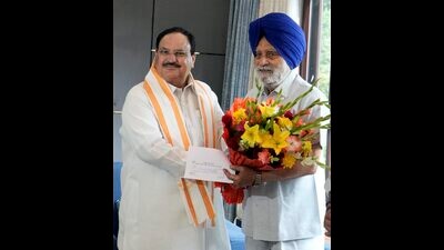 BJP National President JP Nadda with former Punjab Assembly speaker Charanjit Singh Atwal as the latter joins BJP, at his residence in New Delhi. (PTI Photo)