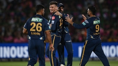 Gujarat Titans' Noor Ahmad (2L) celebrates with teammates after taking the wicket of Rajasthan Royals' Devdutt Padikkal (AFP) Gujarat Titans' Noor Ahmad (2L) celebrates with teammates after taking the wicket of Rajasthan Royals' Devdutt Padikkal (AFP)
