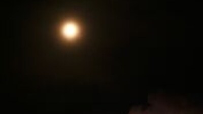 This photograph taken in Srinagar on May 5, 2023, shows the moon on a lunar eclipse day. (AFP) This photograph taken in Srinagar on May 5, 2023, shows the moon on a lunar eclipse day. (AFP)
