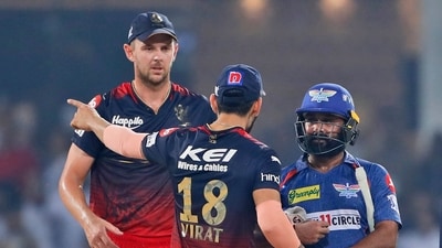 Royal Challengers Bangalore's Virat Kohli, center, talks to Lucknow Super Giants' Amit Mishra, right, after wining the match (AP)