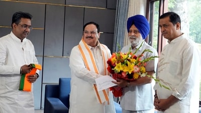BJP National President J.P. Nadda greets former Punjab Assembly speaker Charanjit Singh Atwal as the latter joins BJP, at his residence in New Delhi. (PTI)