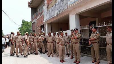 Security heightened in Dujana village during the cremation of gangster Anil Dujana. (HT Photo) Security heightened in Dujana village during the cremation of gangster Anil Dujana. (HT Photo)
