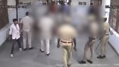 The purported CCTV video of the body of gangster Tillu Tajpuriya being dragged by cops inside Tihar jail. (Twitter/ANI)
