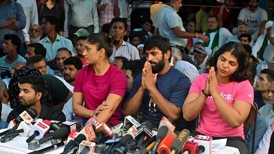 Wrestlers Bajrang Punia, Vinesh Phogat and Sakshi Mallik address the press conference in the ongoing protest against the Wrestling Federation of India (WFI) chief Brij Bhushan Sharan Singh, at Jantar Mantar, in New Delhi on Thursday. (ANI) Wrestlers Bajrang Punia, Vinesh Phogat and Sakshi Mallik address the press conference in the ongoing protest against the Wrestling Federation of India (WFI) chief Brij Bhushan Sharan Singh, at Jantar Mantar, in New Delhi on Thursday. (ANI)