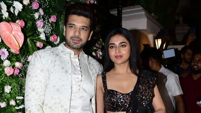 Karan Kundrra and Tejasswi Prakash pose together at a party. Karan Kundrra and Tejasswi Prakash pose together at a party.