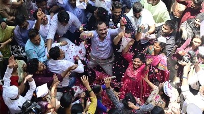 NCP workers celebrate outside party office in Mumbai after committee's decision rejecting Pawar's resignation. (Anshuman Poyrekar/ Hindustan Times) NCP workers celebrate outside party office in Mumbai after committee's decision rejecting Pawar's resignation. (Anshuman Poyrekar/ Hindustan Times)