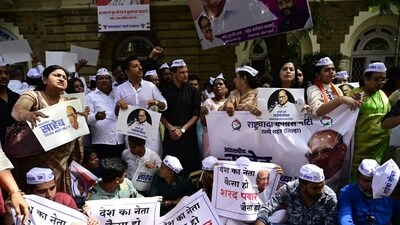 NCP workers outside the party office before the announcement of the decision by the panel. (Anshuman Poyrekar/ Hindustan Times) NCP workers outside the party office before the announcement of the decision by the panel. (Anshuman Poyrekar/ Hindustan Times)