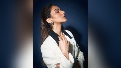 Rakul accessorized her outfit with stone-studded stud earrings, silver rings on her fingers, and black loafers, completing her chic and sophisticated look with a touch of elegance and class. (Instagram/@rakulpreet)