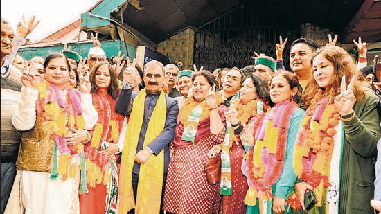 Chief minister Sukhvinder Singh Sukhu and Congress’s winning candidates showing victory signs after the results of the Shimla MC polls. (Deepak Sansta /Ht)