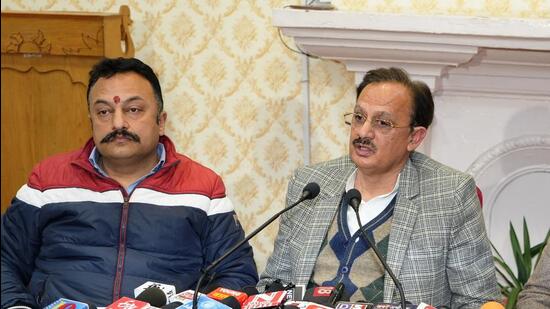 Industries minister Harshwardhan Chauhan (right) and education minister Rohit Thakur in Shimla on Friday. (HT Photo)