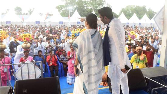 West Bengal chief minister and TMC Leader Mamata Banerjee with party general secretary Abhishek Banerjee during a public meeting on Day 10 of Jono Sanjog Yatra in Malda on Thursday. (ANI)