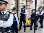 King Charles coronation: A photo posted on Twitter showed Smith sitting on the ground surrounded by a group of police officers.