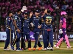 Gujarat Titans players celebrate the wicket of Rajasthan Royals' Sanju Samson. Gujarat Titans players celebrate the wicket of Rajasthan Royals' Sanju Samson.