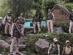 Security personnel near the site of the encounter with terrorists in Kandi area of Rajouri district.