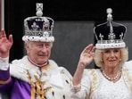 Britain's King Charles III and Queen Camilla wave to the crowds from the balcony of Buckingham Palace after the coronation ceremony in London.