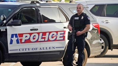 A law enforcement officer guards the entrance to a shopping center after a shooting Saturday, May 6, 2023, in Allen, Texas. (AP Photo/LM Otero) (AP) A law enforcement officer guards the entrance to a shopping center after a shooting Saturday, May 6, 2023, in Allen, Texas. (AP Photo/LM Otero) (AP)