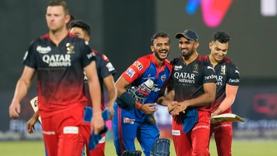 Delhi Capitals batter Axar Patel exchanges greetings with RCB players after the IPL match at the Arun Jaitley Stadium in New Delhi (PTI) Delhi Capitals batter Axar Patel exchanges greetings with RCB players after the IPL match at the Arun Jaitley Stadium in New Delhi (PTI)