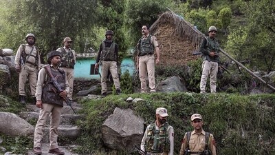 Security personnel near the site of the encounter with terrorists in Kandi area of Rajouri district. (HT_PRINT)