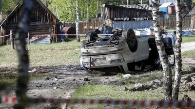 A view shows a damaged white Audi Q7 car lying overturned on a track next to a wood, after Russian nationalist writer Zakhar Prilepin was allegedly wounded in a bomb attack in a village in the Nizhny Novgorod region, Russia. (REUTERS)