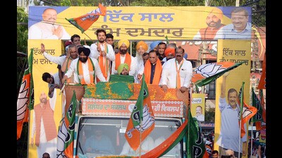 Union Minister for Information and Broadcasting Anurag Thakur with BJP leaders Captain Amarinder Singh, Vijay Rupani and others holds a roadshow for the upcoming Jalandhar byelections, in Jalandhar on Saturday. (ANI Photo)