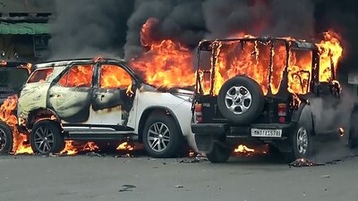 Vehicles set ablaze after a clash broke out in Manipur on Thursday. (ANI)