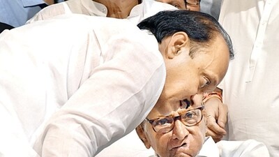 NCP Party President Sharad Pawar in a discussion with party leader Ajit Pawar after announcing being resigned from the party post at YB Chawan Auditorium in Mumbai on Tuesday. (ANI) NCP Party President Sharad Pawar in a discussion with party leader Ajit Pawar after announcing being resigned from the party post at YB Chawan Auditorium in Mumbai on Tuesday. (ANI)