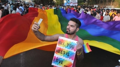 Same sex marriage: A supporter of the LGBT community takes a selfie with a rainbow flag. (Representational image) Same sex marriage: A supporter of the LGBT community takes a selfie with a rainbow flag. (Representational image)