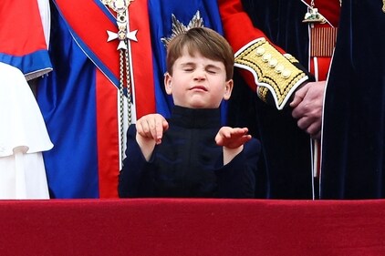 Prince Louis standing on the Buckingham Palace balcony. (REUTERS)