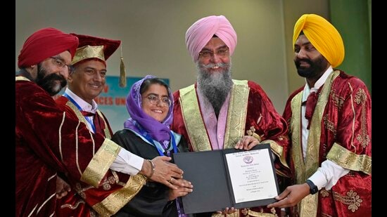 Punjab assembly speaker Kultar Singh Sandhwan and cabinet minister Laljit Singh Bhullar awarding degree to a GADVASU student on Saturday. (Gurpreet Singh/HT)