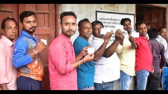 Voters in queue to cast their votes in Prayagraj on Thursday. (HT)