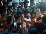 New Delhi, May 07 (ANI): Wrestlers Bajrang Punia, Vinesh Phogat, Sangeeta Phogat, and others during a candle march in view of wrestlers' protest against the alleged sexual harassment of players by WFI chief and BJP MP Brij Bhushan Sharan Singh at Jantar Mantar, in New Delhi on Sunday. (ANI photo)