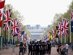 King Charles Coronation: Police officers walk on The Mall the day following Britain's King Charles' coronation, in London, Britain.