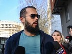 Controversial influencer Andrew Tate arrives at the Directorate for the Investigation of Organized Crime and Terrorism (DIICOT) to attend a hearing.