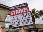 People picket outside of Paramount Pictures studios during the Hollywood writers strike on May 4, 2023 in Los Angeles, California. People picket outside of Paramount Pictures studios during the Hollywood writers strike on May 4, 2023 in Los Angeles, California.