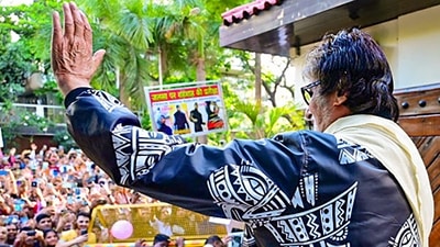 Amitabh Bachchan greets fans outside his Juhu bungalow Jalsa, in Mumbai. (PTI) (PTI) Amitabh Bachchan greets fans outside his Juhu bungalow Jalsa, in Mumbai. (PTI) (PTI)