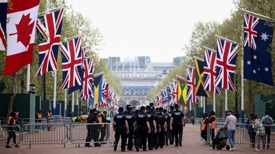 King Charles Coronation: Police officers walk on The Mall the day following Britain's King Charles' coronation, in London, Britain. (Reuters)