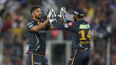 Gujarat Titans' Mohit Sharma, left, celebrates with teammate Srikar Bharat after the dismissal of Lucknow Super Giants' Marcus Stoinis during the Indian Premier League cricket match between Gujarat Titans and Lucknow Super Giants in Ahmedabad, India, Wednesday, May 7, 2023. (AP) Gujarat Titans' Mohit Sharma, left, celebrates with teammate Srikar Bharat after the dismissal of Lucknow Super Giants' Marcus Stoinis during the Indian Premier League cricket match between Gujarat Titans and Lucknow Super Giants in Ahmedabad, India, Wednesday, May 7, 2023. (AP)
