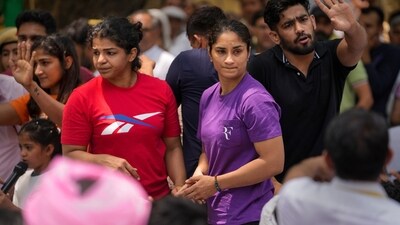 Wrestlers Vinesh Phogat and Sakshi Malik with supporters during their protest against Wrestling Federation of India (WFI) chief Brij Bhushan Sharan Singh. (PTI) Wrestlers Vinesh Phogat and Sakshi Malik with supporters during their protest against Wrestling Federation of India (WFI) chief Brij Bhushan Sharan Singh. (PTI)