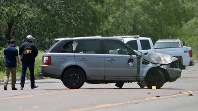 Law enforcement officers investigate the scene after a deadly incident where a car ran into pedestrians near Ozanam Center, a shelter for migrants and homeless, in Brownsville, Texas, U.S. (REUTERS)
