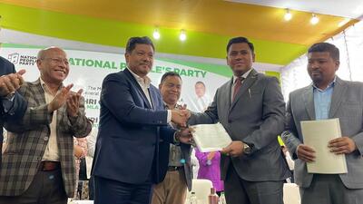 The merger document was signed between NPP chief and chief minister Conrad K Sangma and PDF chief Gavin M Mylliem. (Twitter/Conrad K Sangma) The merger document was signed between NPP chief and chief minister Conrad K Sangma and PDF chief Gavin M Mylliem. (Twitter/Conrad K Sangma)