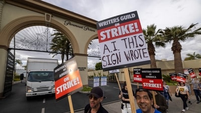 People picket outside of Paramount Pictures studios during the Hollywood writers strike on May 4, 2023 in Los Angeles, California. (Getty Images via AFP) People picket outside of Paramount Pictures studios during the Hollywood writers strike on May 4, 2023 in Los Angeles, California. (Getty Images via AFP)