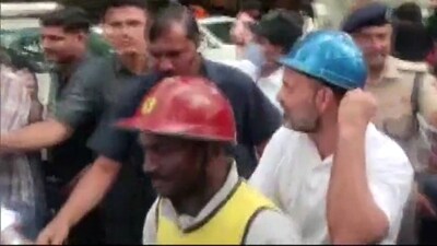 Rahul Gandhi rides pillion on delivery boy's scooter in Bengaluru.