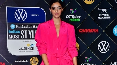 Actor Ananya Panday Panday opted for a monochrome look in a fuchsia pink blazer dress, paired with matching tights. She finished her look with a miniature ‘dollar’ bucket bag. (HT photos.) Actor Ananya Panday Panday opted for a monochrome look in a fuchsia pink blazer dress, paired with matching tights. She finished her look with a miniature ‘dollar’ bucket bag. (HT photos.)