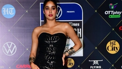 Actor Janhvi Kapoor stunned everyone in a black strapless less with metallic detailing. She paired it with a sleek ponytail and looked stylish as ever. (Ht photos) Actor Janhvi Kapoor stunned everyone in a black strapless less with metallic detailing. She paired it with a sleek ponytail and looked stylish as ever. (Ht photos)