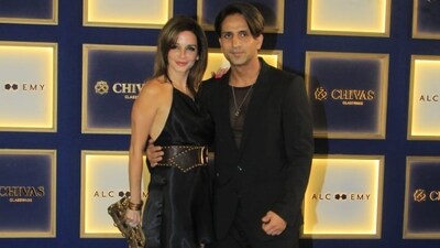 Sussanne Khan wore a little black dress with brown heels and a chunky belt. Actor Arslan Goni matched her in a black suit.&nbsp; 