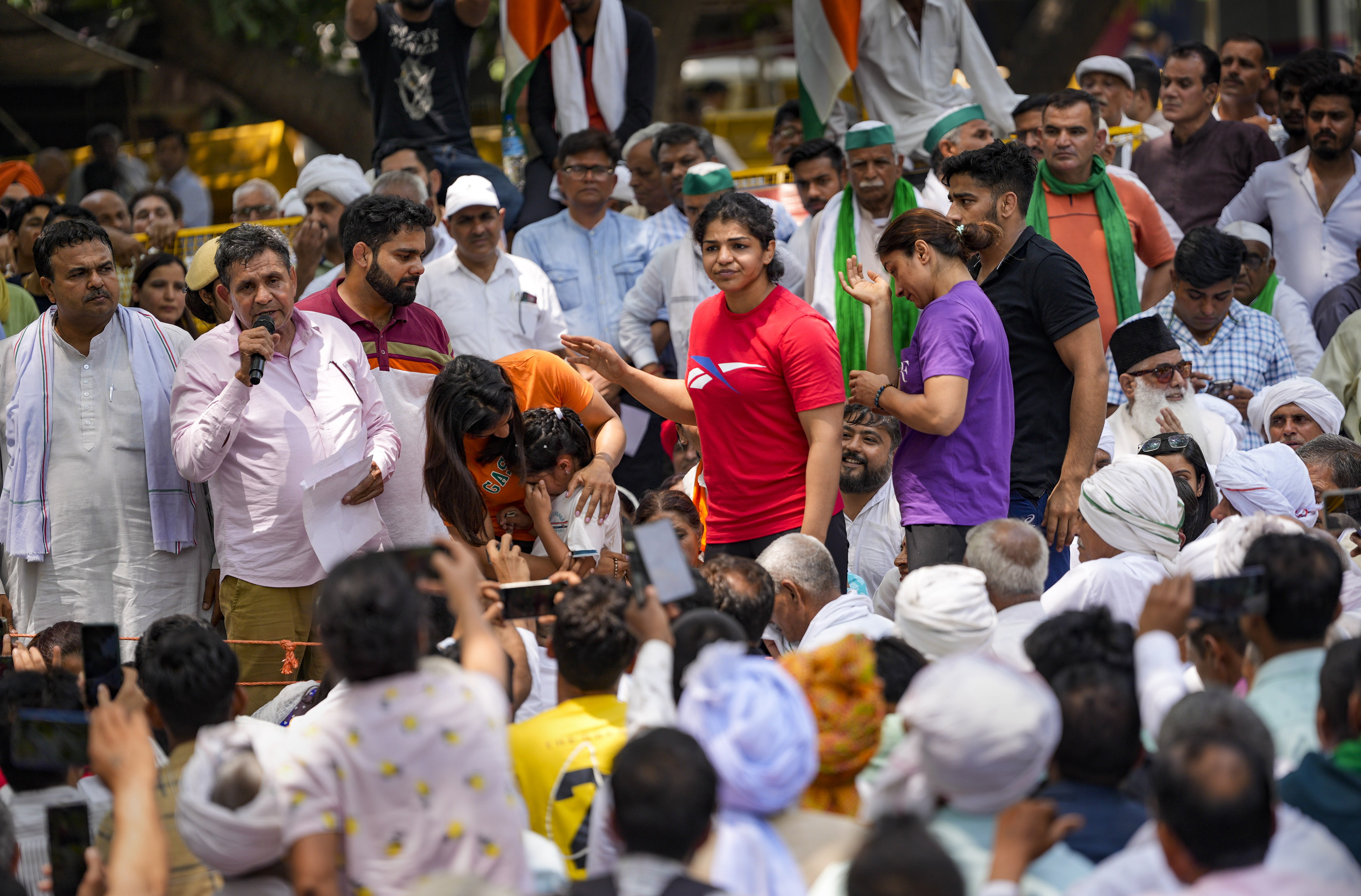 New Delhi: Wrestlers Vinesh Phogat and Sakshi Malik with supporters during their protest against Wrestling Federation of India (WFI) chief Brij Bhushan Sharan Singh, at Jantar Mantar in New Delhi, Sunday, May 7, 2023. (PTI Photo/Ravi Choudhary)(PTI05_07_2023_000124B) (PTI) New Delhi: Wrestlers Vinesh Phogat and Sakshi Malik with supporters during their protest against Wrestling Federation of India (WFI) chief Brij Bhushan Sharan Singh, at Jantar Mantar in New Delhi, Sunday, May 7, 2023. (PTI Photo/Ravi Choudhary)(PTI05_07_2023_000124B) (PTI)