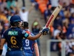 Gujarat Titans batter Wriddhiman Saha celebrates after scoring a half-century. Gujarat Titans batter Wriddhiman Saha celebrates after scoring a half-century.