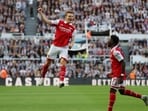 Arsenal's Martin Odegaard celebrates scoring their first goal with Bukayo Saka 