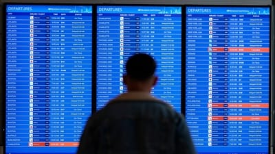 FILE - A traveler looks at a flight board with delays and cancellations at Ronald Reagan Washington National Airport in Arlington, Va., Wednesday, Jan. 11, 2023. Congressional investigators said in a report Friday, April 28, 2023, that an increase in flight cancellations as travel recovered from the pandemic was due mostly to factors that airlines controlled, including cancellations for maintenance issues or lack of a crew. (AP) FILE - A traveler looks at a flight board with delays and cancellations at Ronald Reagan Washington National Airport in Arlington, Va., Wednesday, Jan. 11, 2023. Congressional investigators said in a report Friday, April 28, 2023, that an increase in flight cancellations as travel recovered from the pandemic was due mostly to factors that airlines controlled, including cancellations for maintenance issues or lack of a crew. (AP)
